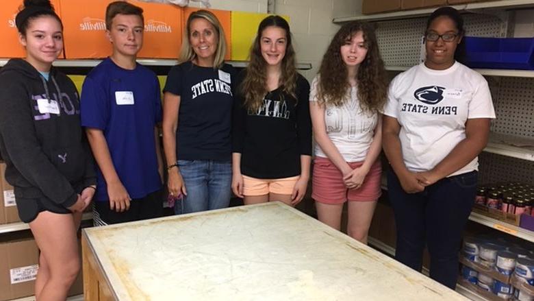 campers pose at food bank