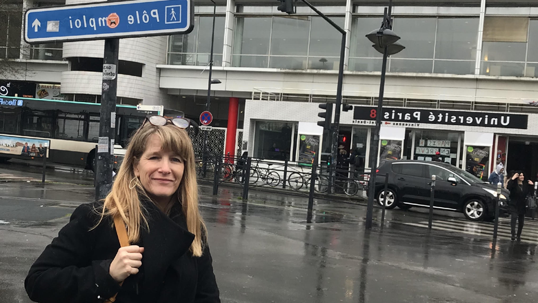 woman in front of a university in Paris, France