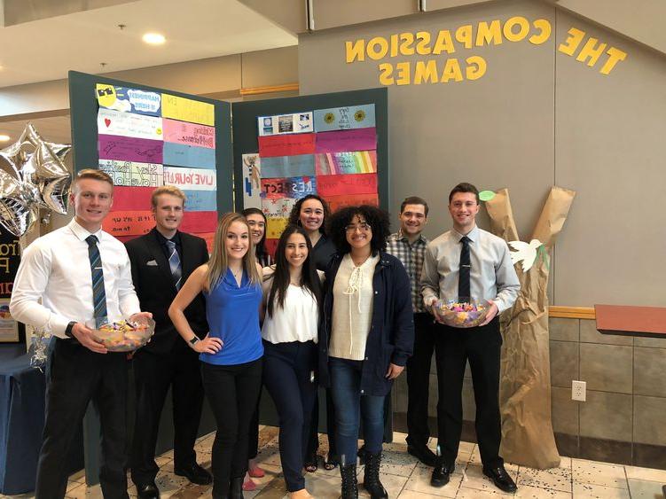 students in front of poster display